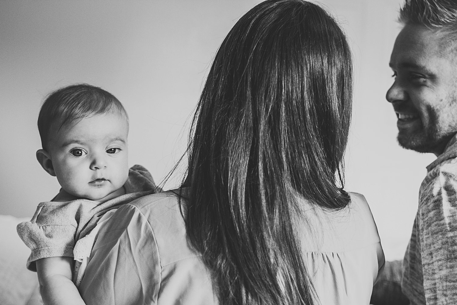 Candid photo of parents with baby