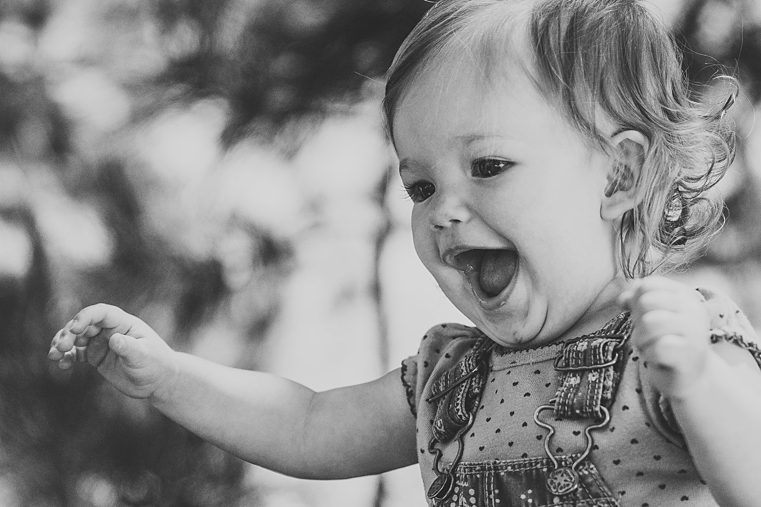 Toddler girl opening mouth in delight