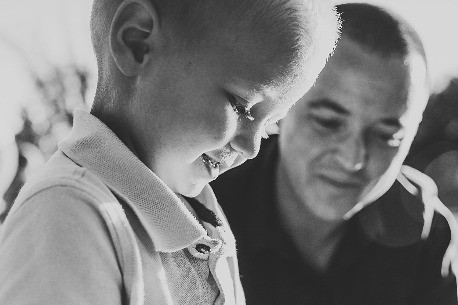 Candid family portrait of dad with young boy