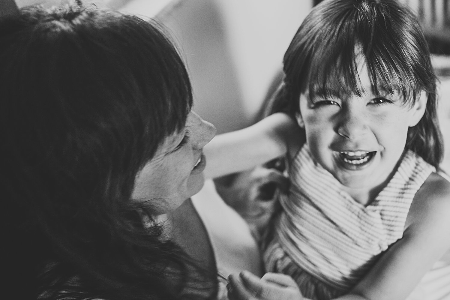 Daughter laughing with mom