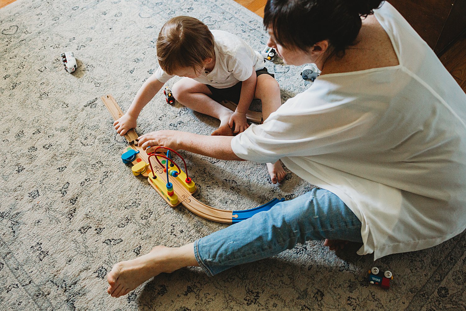 Mom and boy playing with toy